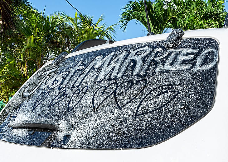 'Just married' written on a car window.