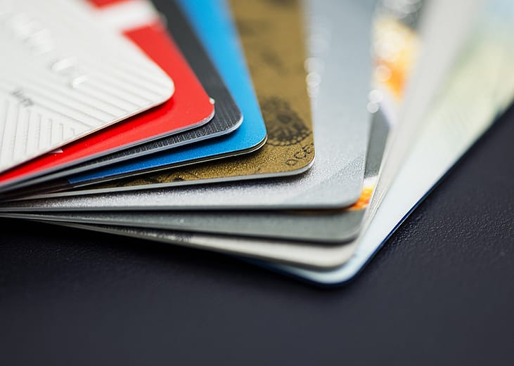 A stack of multicolored credit cards. 