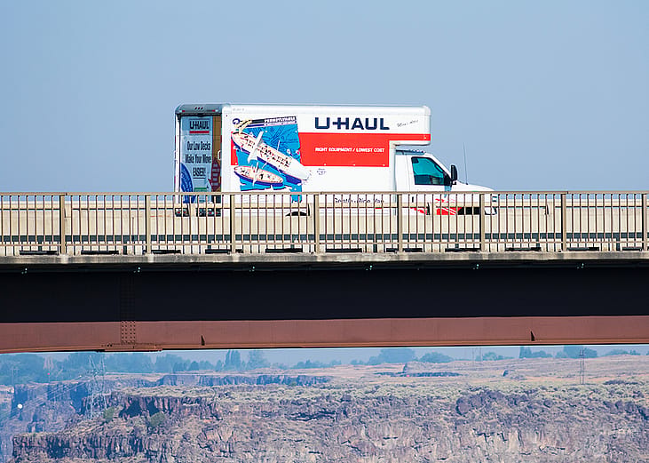 A U-Haul moving truck traveling on Perrine Memorial Bridge in Idaho.