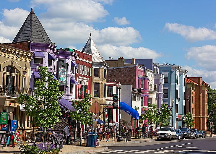 A row of colorful houses in a neighborhood in Adams Morgan, Washington, D.C.