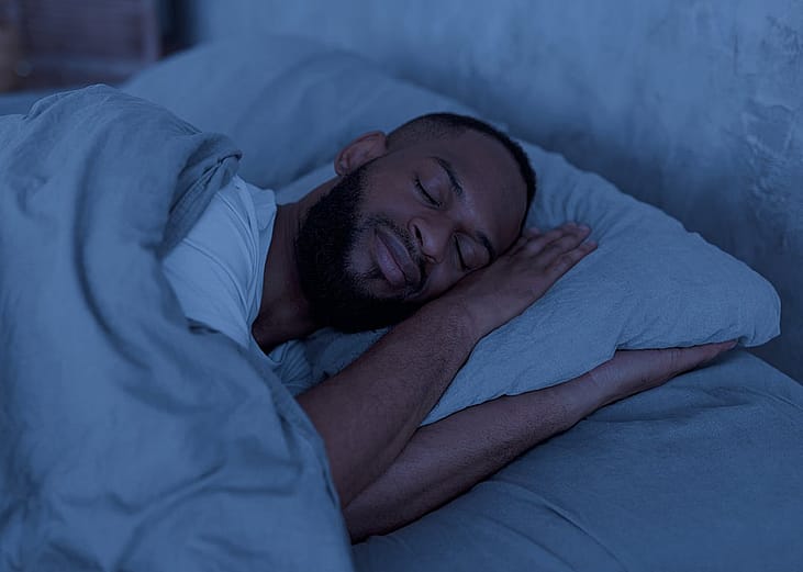 A person sleeping well in a bedroom.