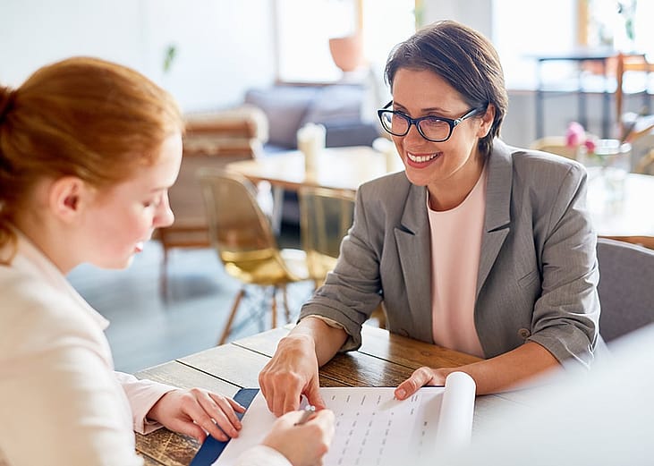 An employer discussing the terms of contract to an applicant.