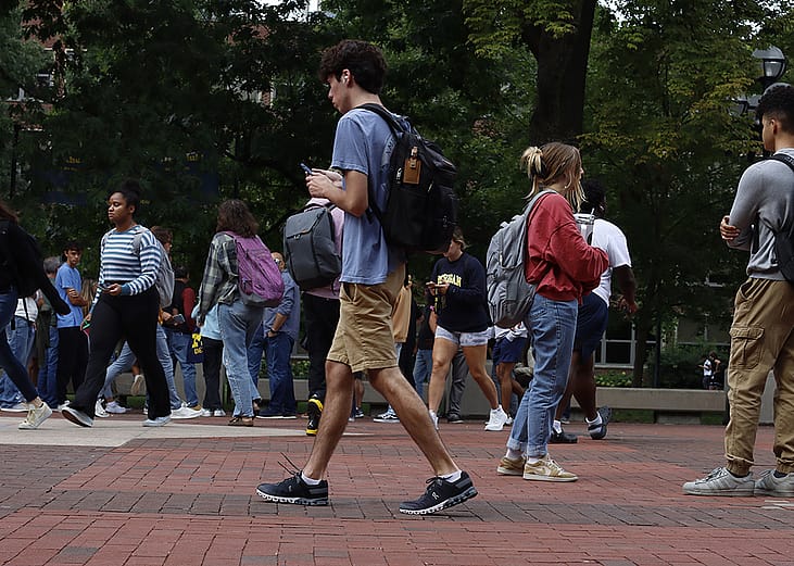 Students walking to their classes in a university town in Ann Arbor, Michigan, USA.