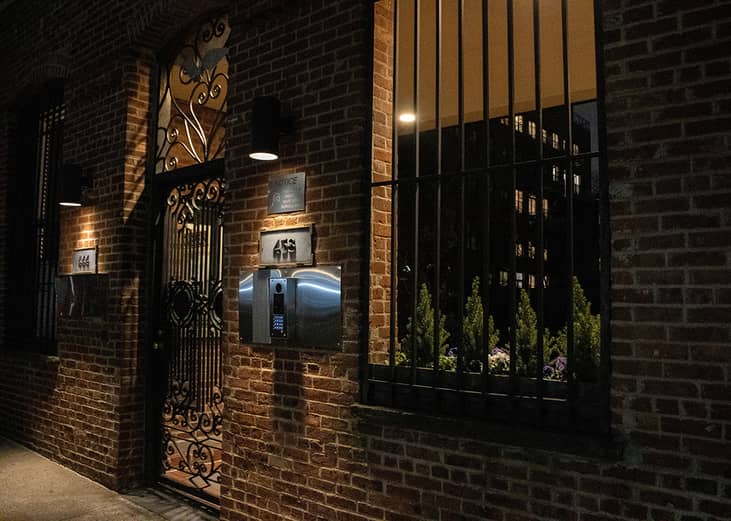 An exterior of a doorway in a city neighborhood in New York, USA.