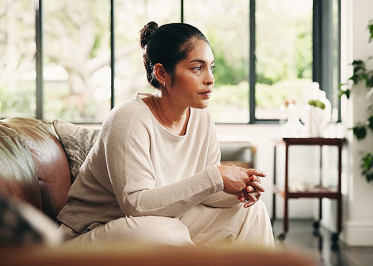 A person taking her time for calm contemplation and reflection at home.