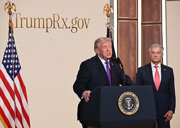 US President Donald Trump speaks about TrumpRx website as the Administrator for the Centers for Medicare & Medicaid Services Mehmet Oz listens, in the South Court Auditorium of the White House in Washington, DC, on February 5, 2026.