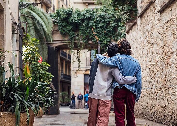 A male couple looking at a sight during a trip.