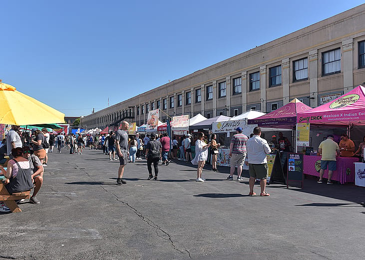 A lane of vendors during Smorgasburg LA, a Sunday outdoor food and shopping market event in California.