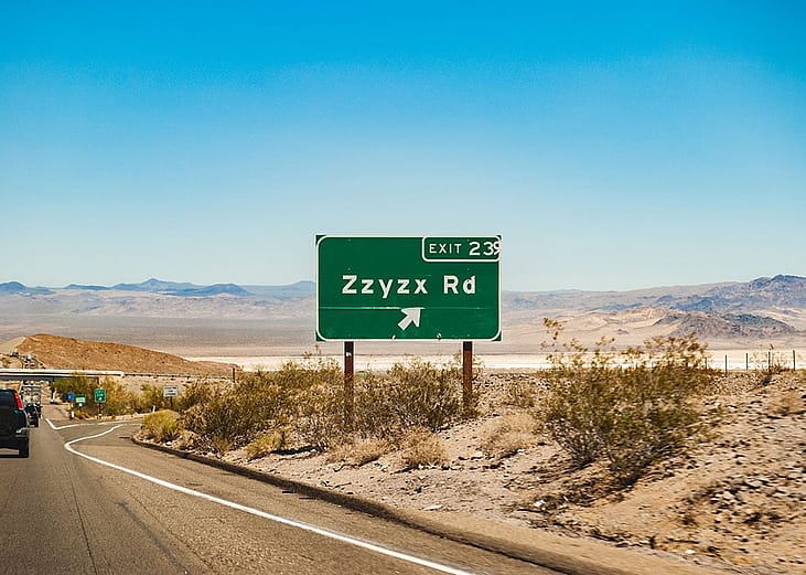 Zzyzx Rd sign at Interstate 15 freeway from Los Angeles, California to Las Vegas, Nevada in USA.