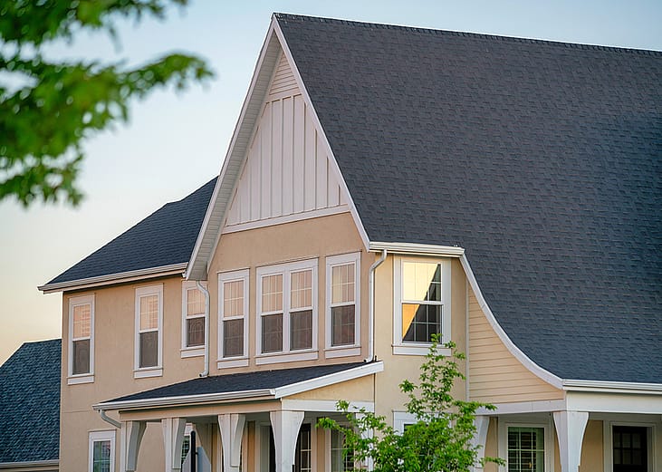 A two-story residential house with gray roofing.