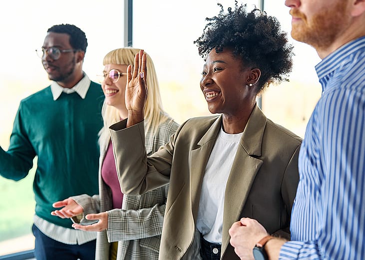A diverse business team engaging in a meeting.