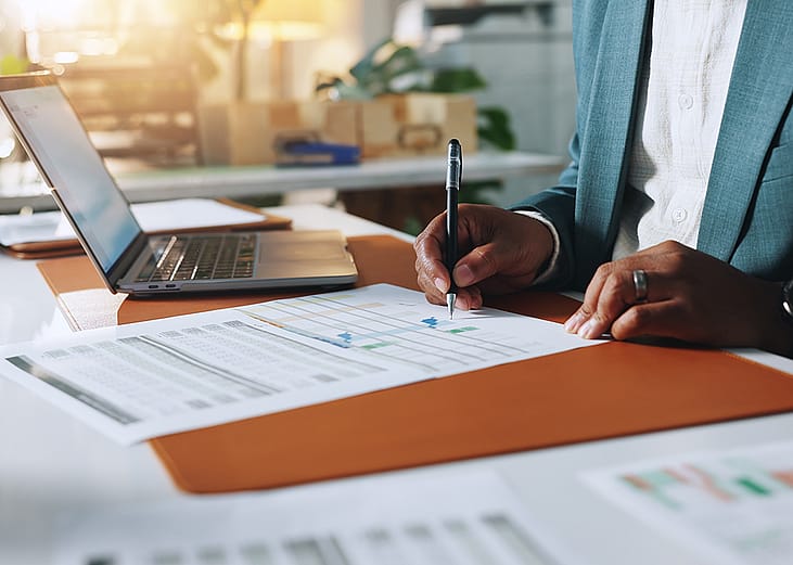 A businessman signing documents.