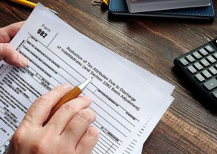 Person reviewing to sign a Form 982.