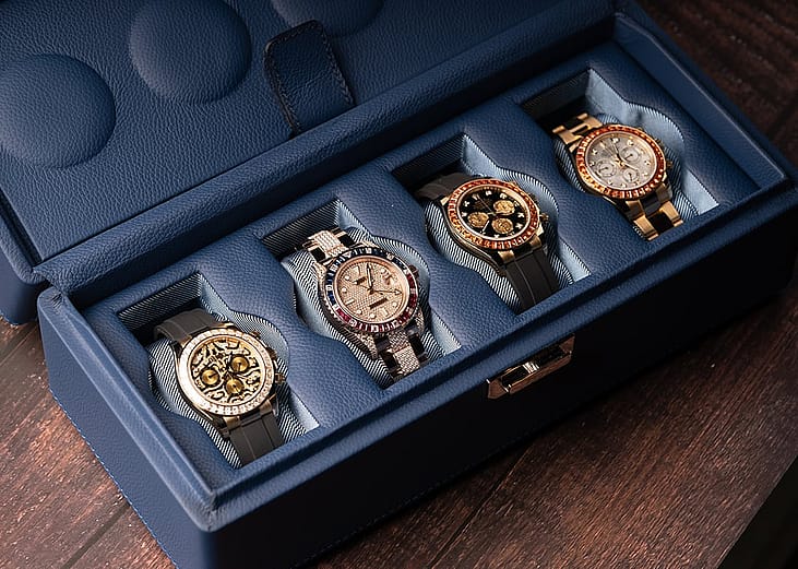 Four rolex watches in a luxury case.