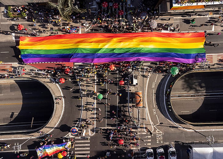 An aerial shot of a massive pride flag from the 28th edition of São Paulo LGBT+ Pride Parade in Brazil.