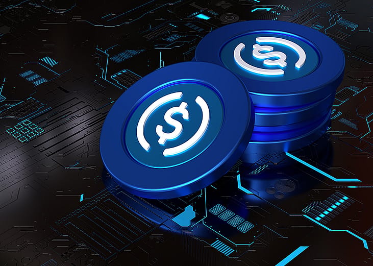 A 3D rendering of a stack of stablecoins on top of a computer circuit system.