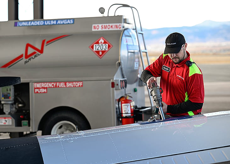 A line service technician refuels a plane using a Federal Aviation Administration approved unleaded aviation fuel at Sheltair at Rocky Mountain Metropolitan Airport.