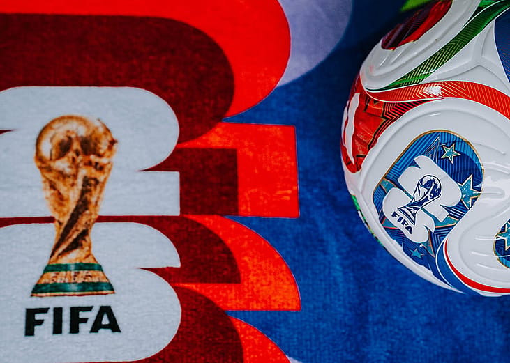 The World Cup 2026 branding for USA, Mexico, and Canada and the Adidas Trionda ball both in a FIFA-themed background.