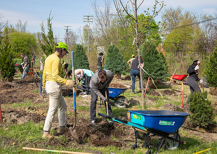 Volunteers planting trees for Arboretum Detroit on Earth Day 2026 in Michigan, USA.