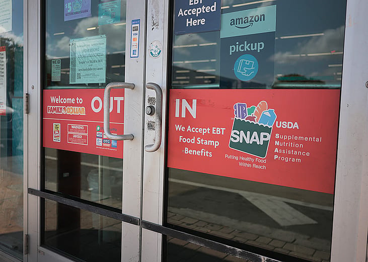 A store with signage indicating that it accepts SNAP benefits.