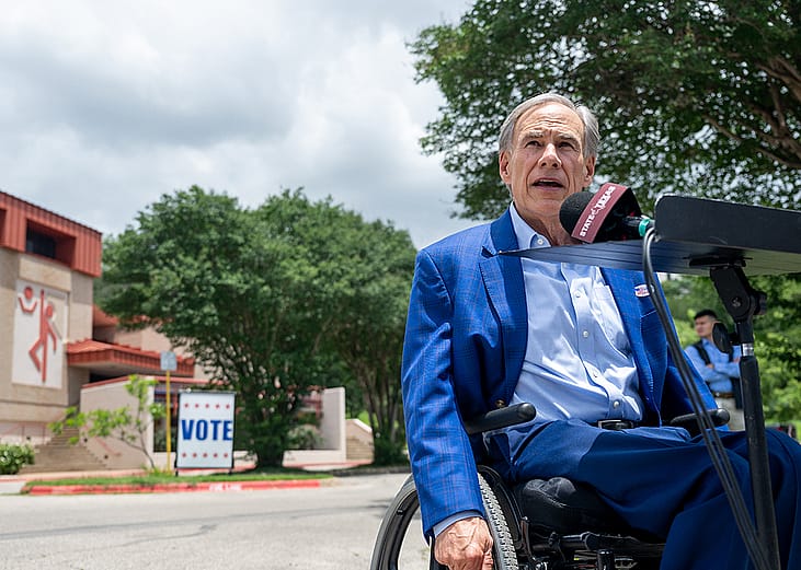 Texas Governor Greg Abbott speaks during a news conference after casting his vote during early voting of the primary runoff at the Austin Recreation Center on May 18, 2026 in Austin, Texas. 
