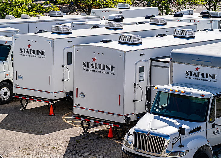 A view of Starline Production rental trucks and trailers.
