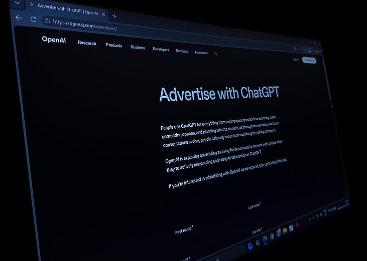 Close up image of the official OpenAI webpage displaying the option to "Advertise With ChatGPT".