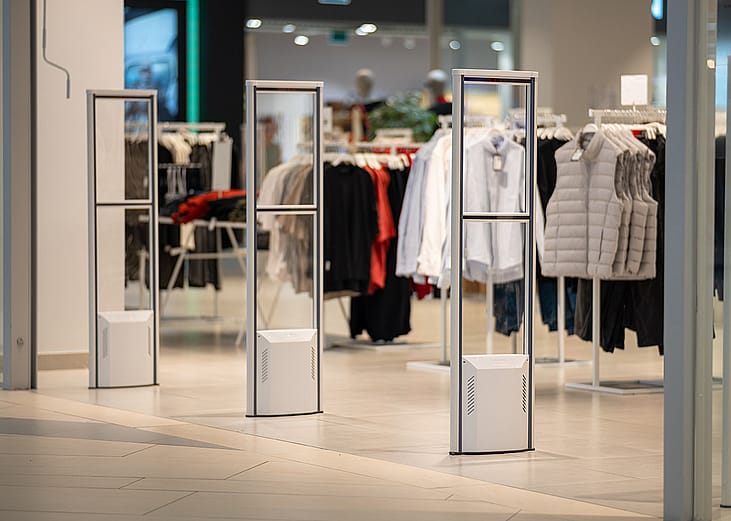 Detectors lined up at the entrance of a clothing store.