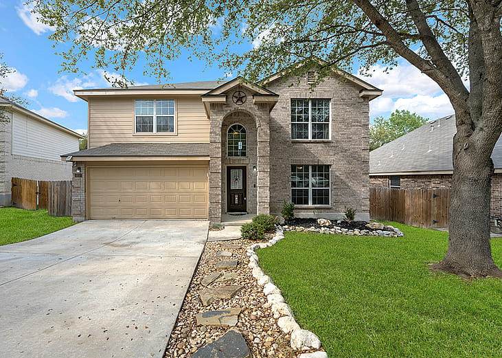 A front yard view of a modern American house. 