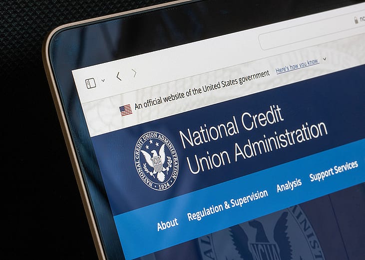 A website homepage of the United States' National Credit Union Administration displayed from a laptop screen.
