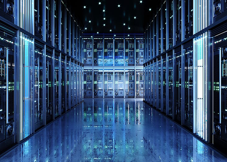 Interior of a data center showing a hall of server packs.