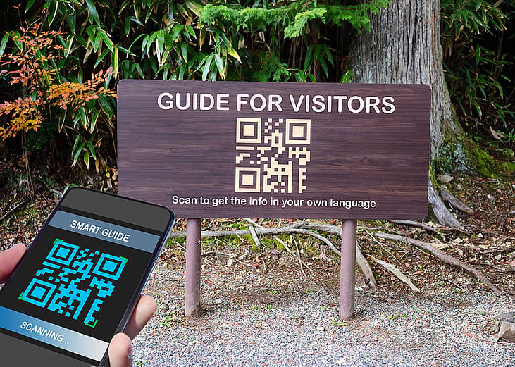 A signage with a guide for visitors QR code label for traveling.