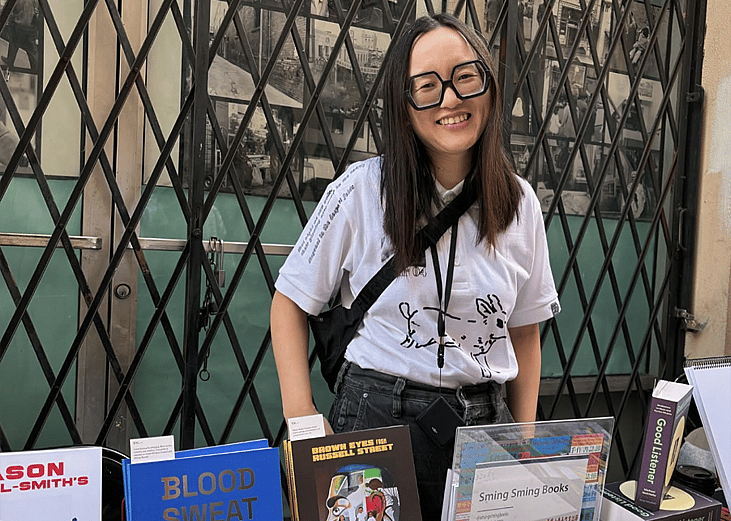 Artist-publisher Vivian Sming posing for a photo in the Sming Sming Books booth.