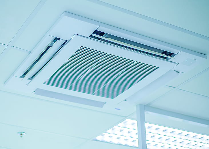 A ceiling air conditioning unit in an office.