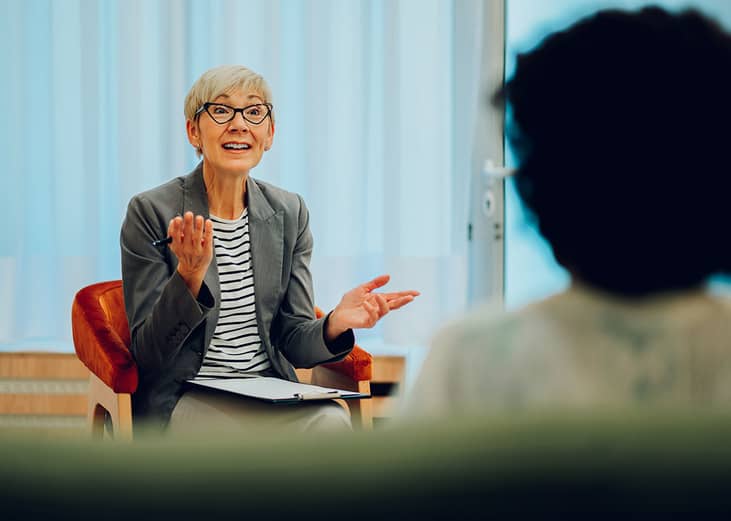 A female psychotherapist in a session with her client.