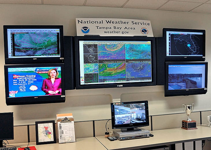 A meteorologist's work station monitoring hurricane alerts in Florida.