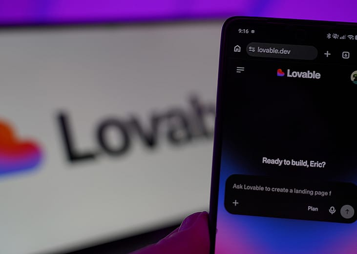 The Lovable AI app with a background of their logo.