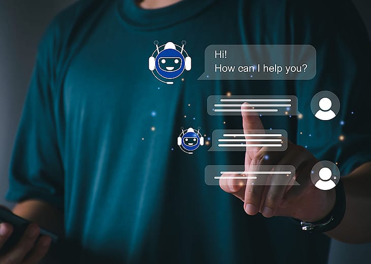 A person utilizing an AI chatbot that responds to online messages or inquiries.