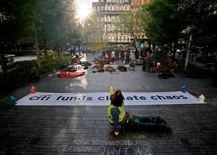 An environmental activist protesting outside CitiBank Headquarters in New York City, USA.
