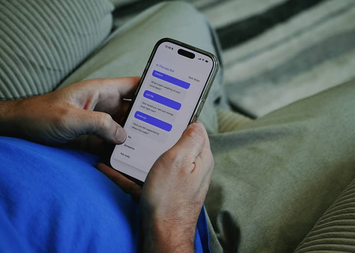 A person using an AI therapy bot from his smartphone.