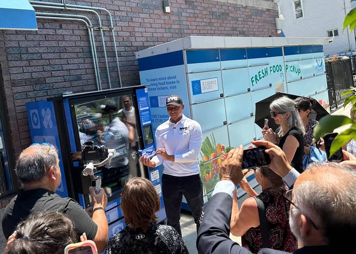 New York City Health Commissioner Dr. Alister Martin shows how a new "public health" vending machine works as Adrienne Abbate, executive director of Partnerships for Community Wellness, looks on on June 29, 2026, in Staten Island.