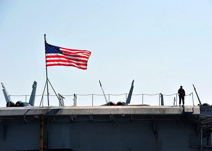 The United States flag is seen within a defense facility.