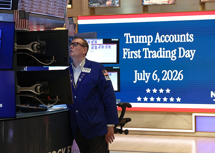 A trader checking monitors moments before US President Donald Trump rings the opening bell of the New York Stock Exchange (NYSE) in New York on July 6, 2026 from the Oval Office in celebration of the First Day of trading of Trump Accounts.
