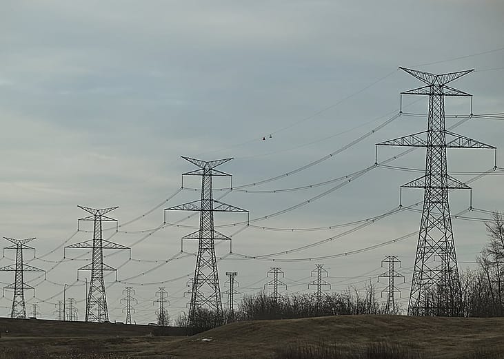 Electric poles and power lines seen in South-East area of Edmonton, Alberta, Canada.