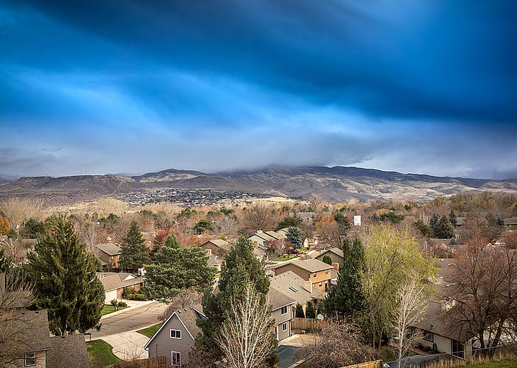 Aerial view of residential homes among the rocky mountains in Boise, Idaho.