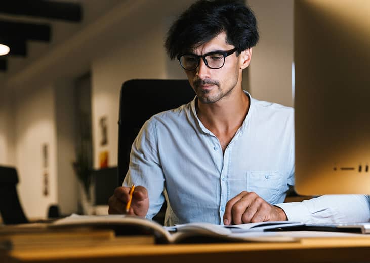 A focused businessman working at night.