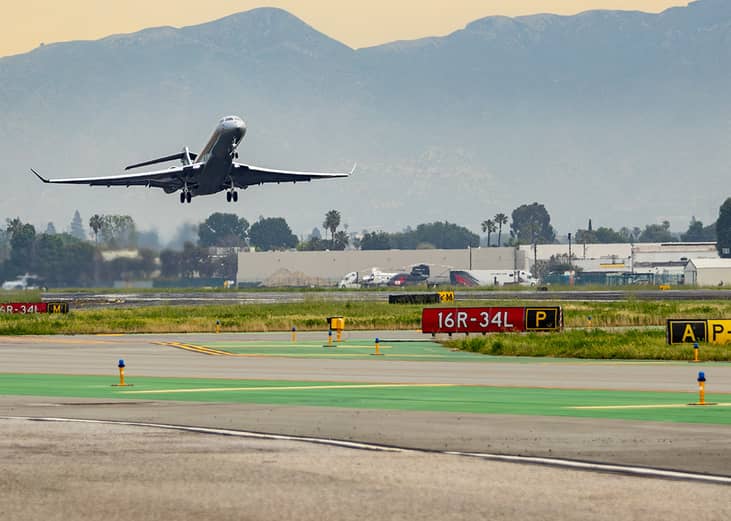 A Global 7500, built by Bombardier is seen climbing out of runway 16R on an afternoon departure from California.