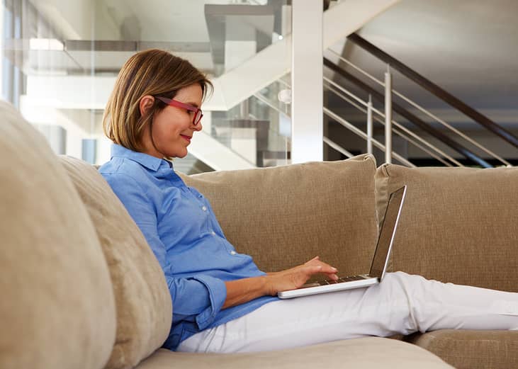 A businesswoman working at home with her laptop.