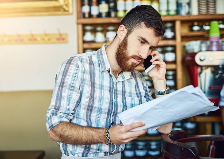 A store manager asking someone for a payment extension of their orders during a phone call.