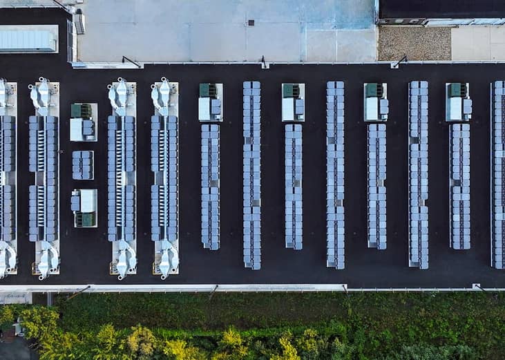 An aerial, top-down view of an industrial scale power storage system within a facility.